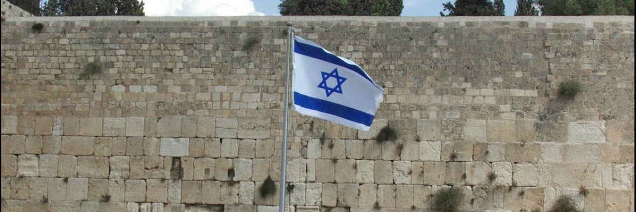 Photo of Israeli flag by the Western Wall