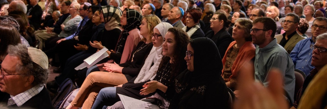PITTSBURGH, PA - NOVEMBER 2: Over 1000 people crammed into the sanctuary at Temple Sinai for Friday evening Shabbat services on November 2, 2018 in Pittsburgh, Pennsylvania. Temple Sinai, just a half mile from Tree of Life Synagogue in the Squirrel Hill neighborhood, opened their doors to Pittsburgh-area Jews and people of all faiths in the wake of the mass shooting that left 11 people dead at the Tree of Life on October 27, 2018.(Photo by Jeff Swensen/Getty Images)