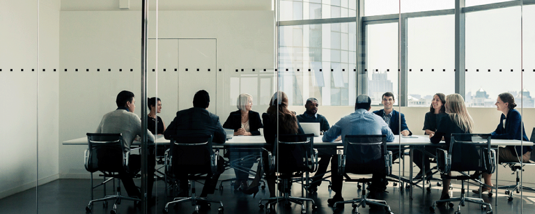 People sitting around a table in a conference room