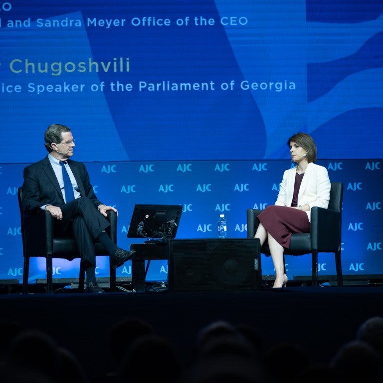 Photo of David Harris and the First Vice-Speaker of the Parliament of Georgia Tamar Chugoshvili speaking at AJC Global Forum 2018