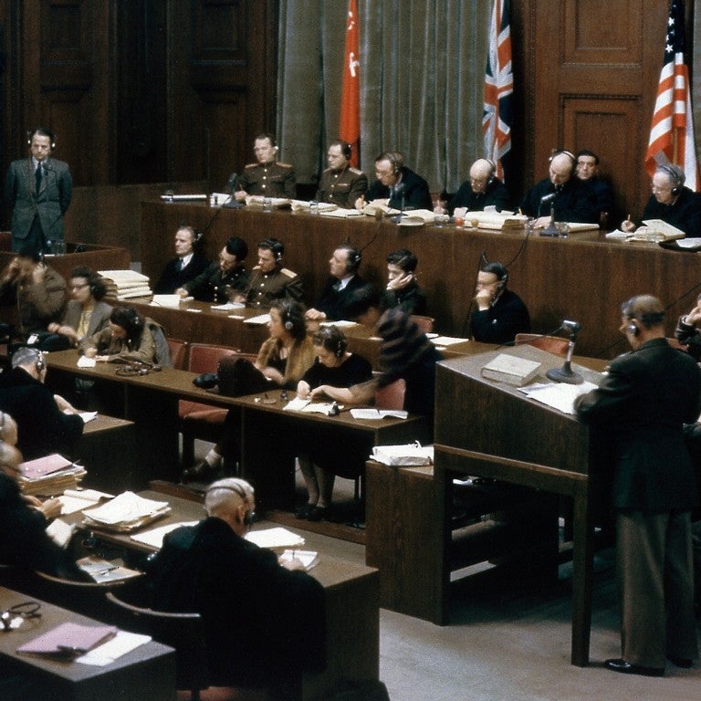 The trial takes place of SS and Sicherheitsdienst leader Ernst Kaltenbrunner (1903 - 1946, standing, left) in Room 600 at the Palace of Justice during the International Military Tribunal (IMT), Nuremberg, Germany, 19th-20th December 1945. 