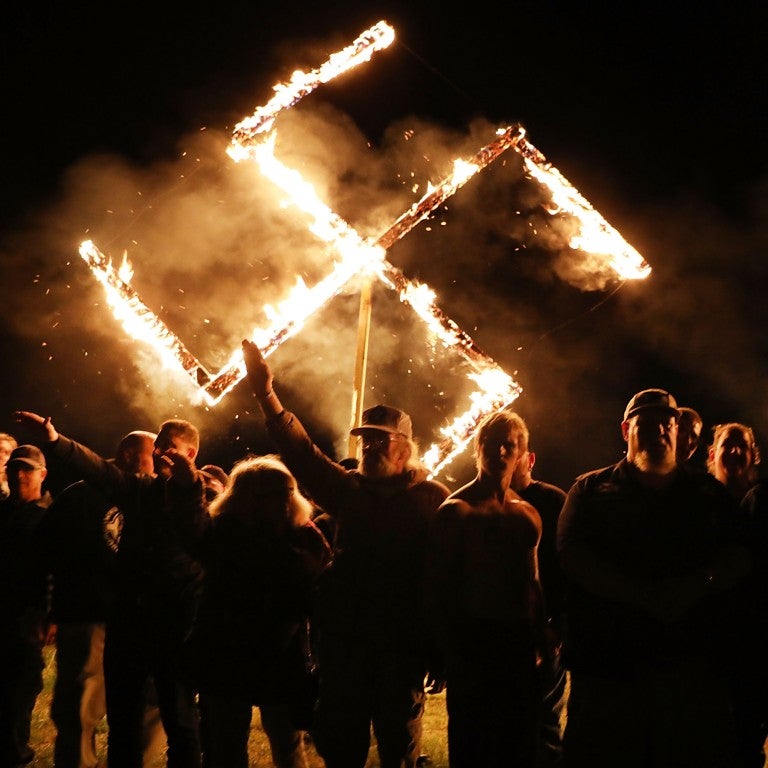 Unite the Right rally in Charlottesville; burning swastika