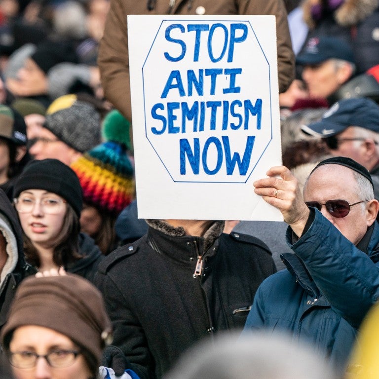 Rally against antisemitism, sign that reads "stop antisemitism now"