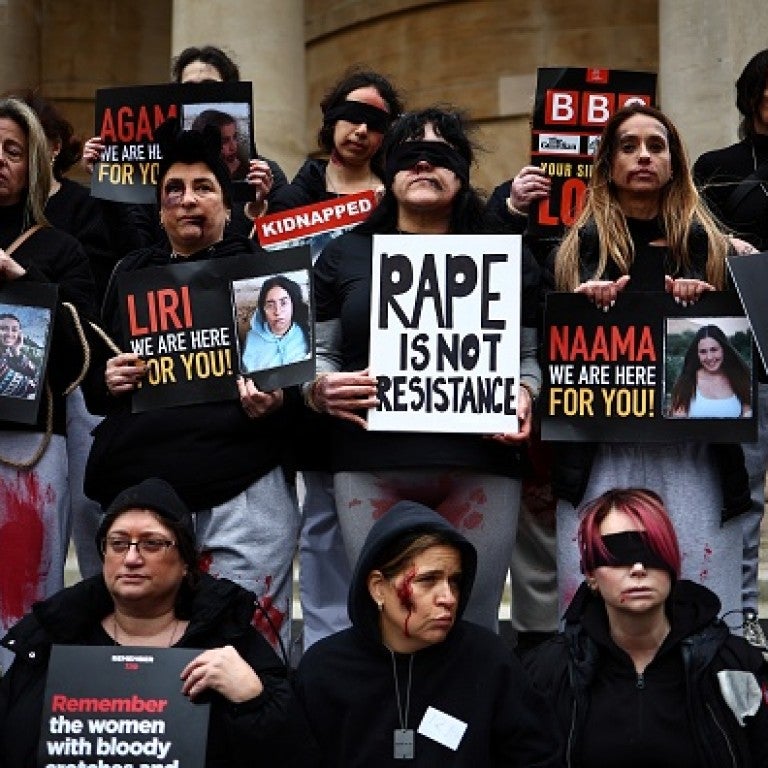 Protesters wearing fake blood make-up and holding placards take part in a demonstration "Rape is NOT resistance" outside the BBC headquarters, in London, on February 4, 2024 to bring attention to the plight of the kidnapped Israeli women in Gaza who have been held by Hamas for over 110 days. Thousands of civilians, both Palestinians and Israelis, have died since October 7, 2023, after Palestinian Hamas militants based in the Gaza Strip entered southern Israel in an unprecedented attack triggering a war decl