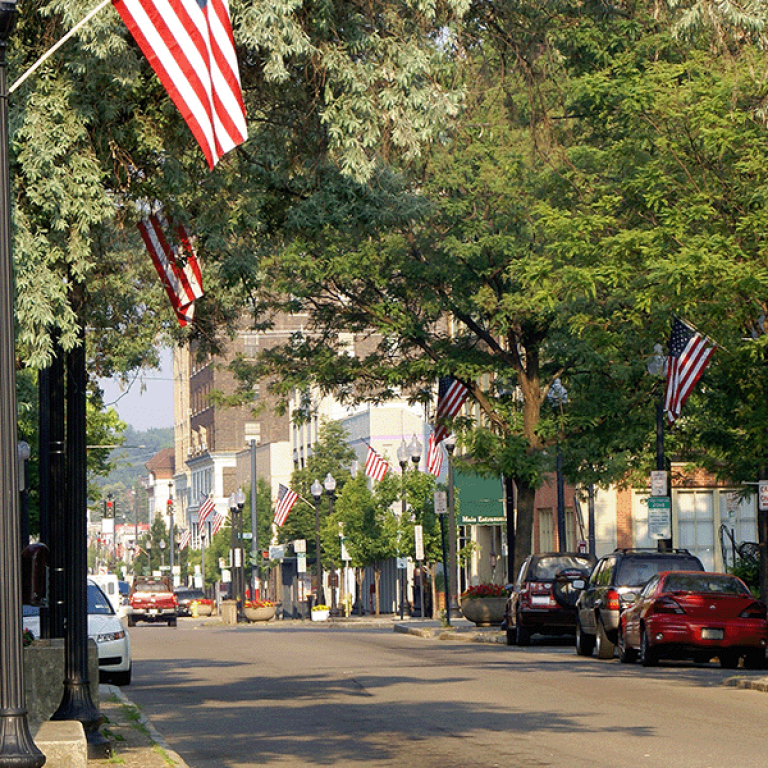 Photo of a main street with American flags